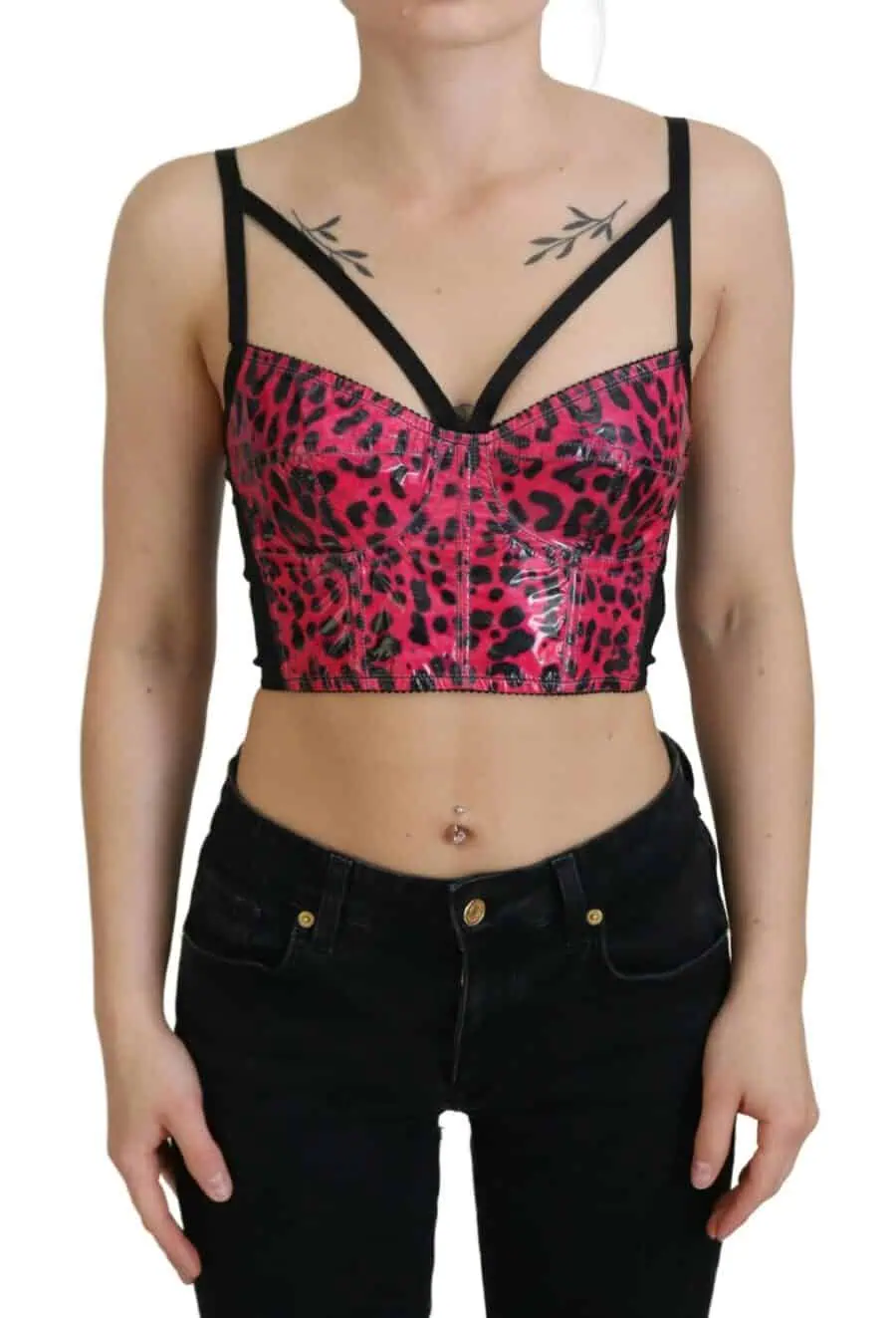 Leopard print bustier top with strappy black details and a glossy finish, styled with black jeans.
