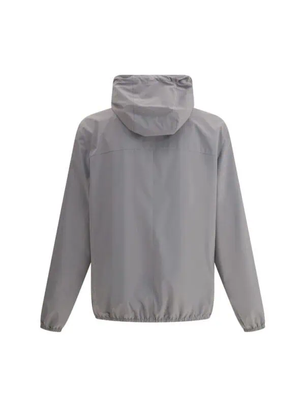 Light gray men's waterproof windbreaker jacket with hood, lightweight and stylish for outdoor activities. Perfect for rain protection and casual wear, combining durability with comfort.