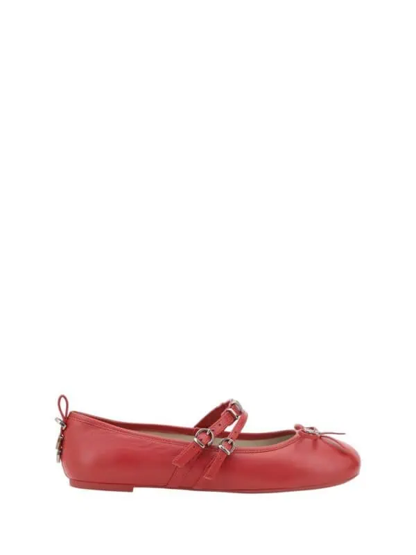 Pink leather ballet flats with double ankle straps and bow detail, stylish and perfect for everyday wear.