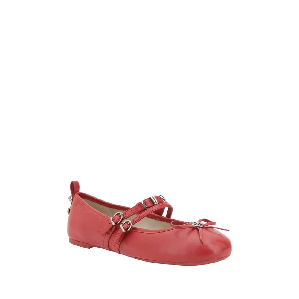 Red ballet flat shoe with ankle strap and bow detail, perfect for stylish everyday wear, made from premium leather for comfort and durability.
