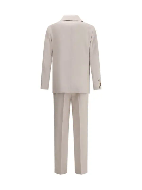 Slim fit beige suit with tailored blazer and matching trousers, perfect for formal or business occasions. Crafted from high-quality fabric for a stylish and sophisticated look.