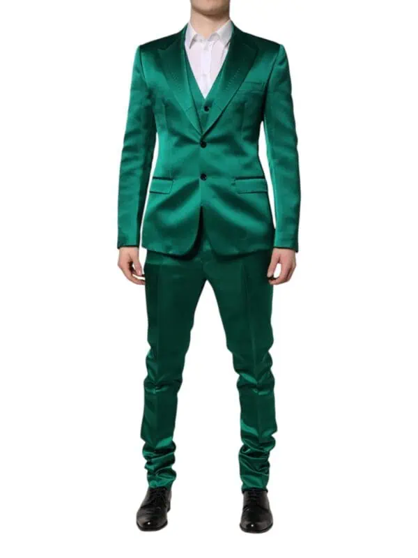 Shiny emerald green satin men's tuxedo suit with black shoes and white shirt for formal events, wedding, or prom. perfect for making a stylish statement and elegant appearance.