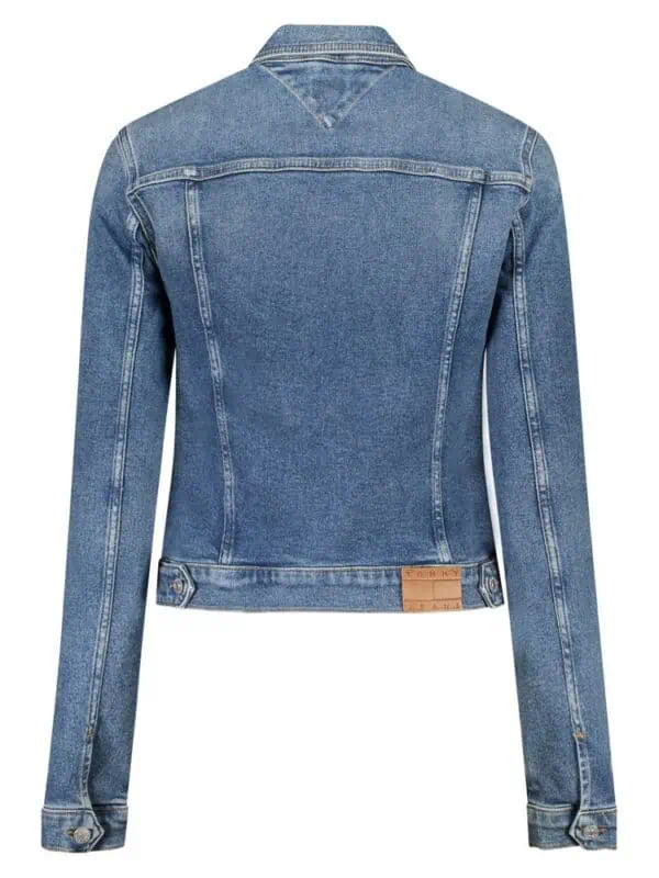 Cotton blue denim jacket with branded leather patch at hem, classic design with buttoned cuffs and adjustable waist, perfect for casual and streetwear styles, from Lux Brands.
