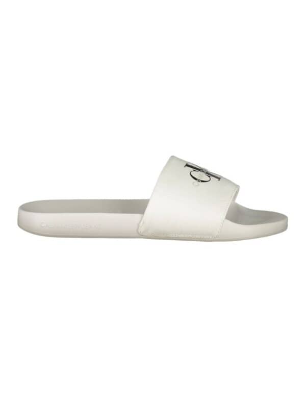 White Calvin Klein slide sandal with logo strap for casual luxury footwear.