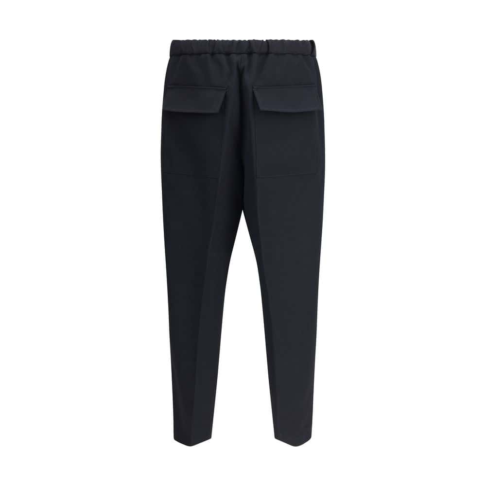 Slim-fit black casual trousers with functional back pockets, perfect for stylish everyday wear and versatile outfits. Made from high-quality materials for comfort and durability.