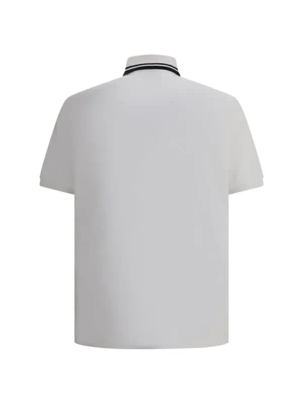 Vintage White Polo Shirt with Black Stripes on Collar for Men and Women, Casual and Fashionable Style, Comfortable Fit for Everyday Wear.