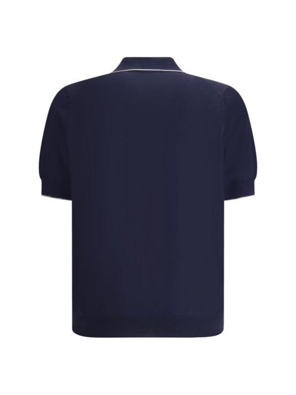 Navy blue men's polo shirt with white piping, stylish design, and comfortable fit for casual or smart-casual occasions.