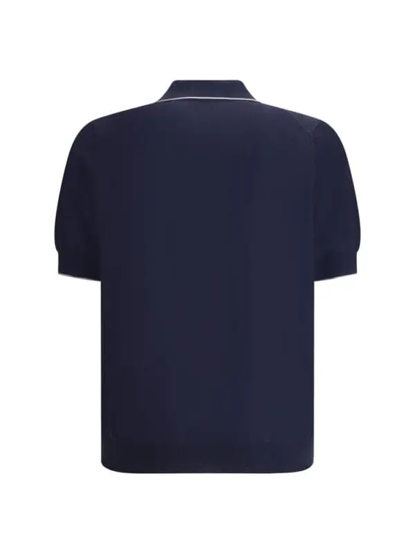 Navy blue men's polo shirt with white piping, stylish design, and comfortable fit for casual or smart-casual occasions.