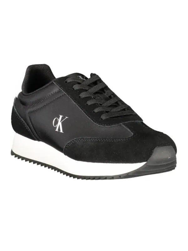 Stylish black Calvin Klein sneakers with white midsole, perfect for casual and athletic wear, featuring classic branding and comfortable design.