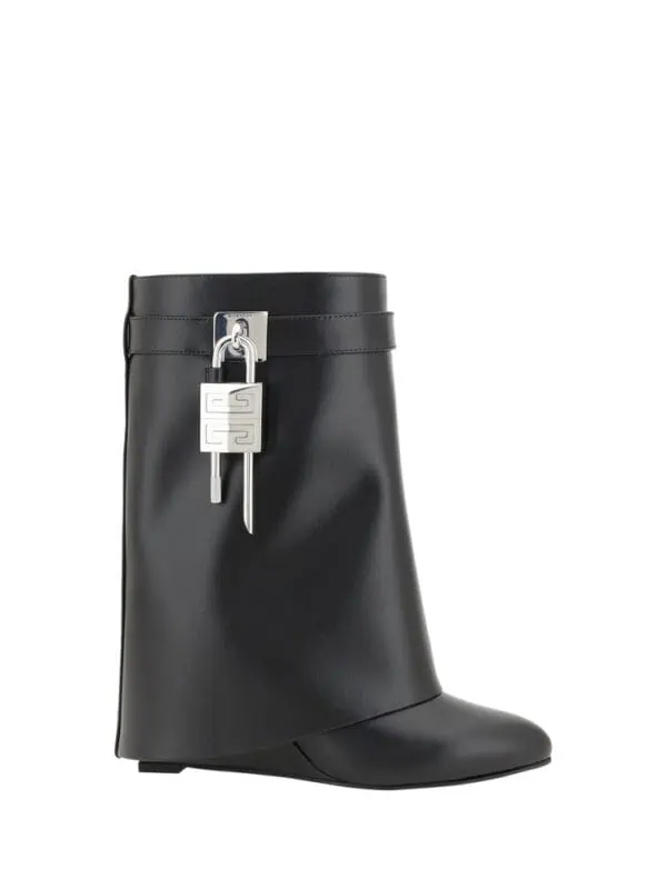 Black designer ankle boot with silver hardware and decorative lock detail, luxury fashion footwear for women.