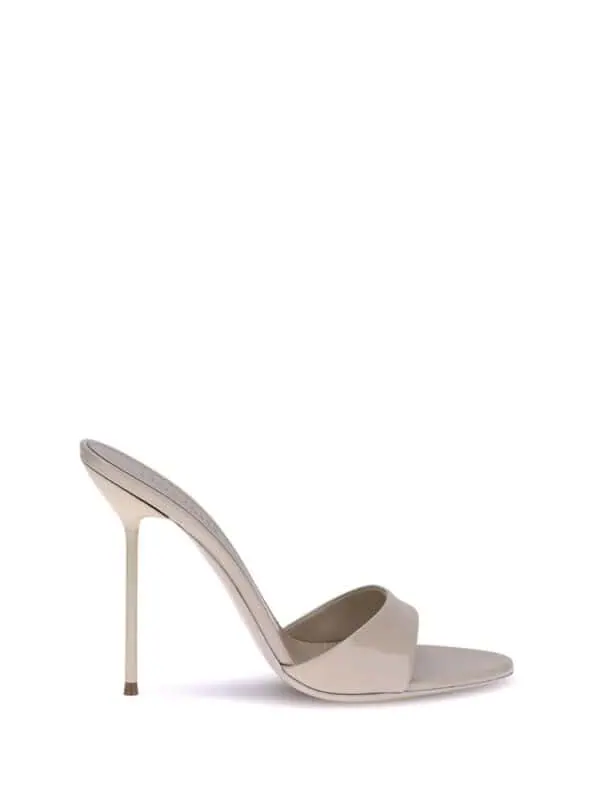 Elegant nude high-heeled mule sandal with sleek design, pointed toe, and stiletto heel for sophisticated style and comfort.