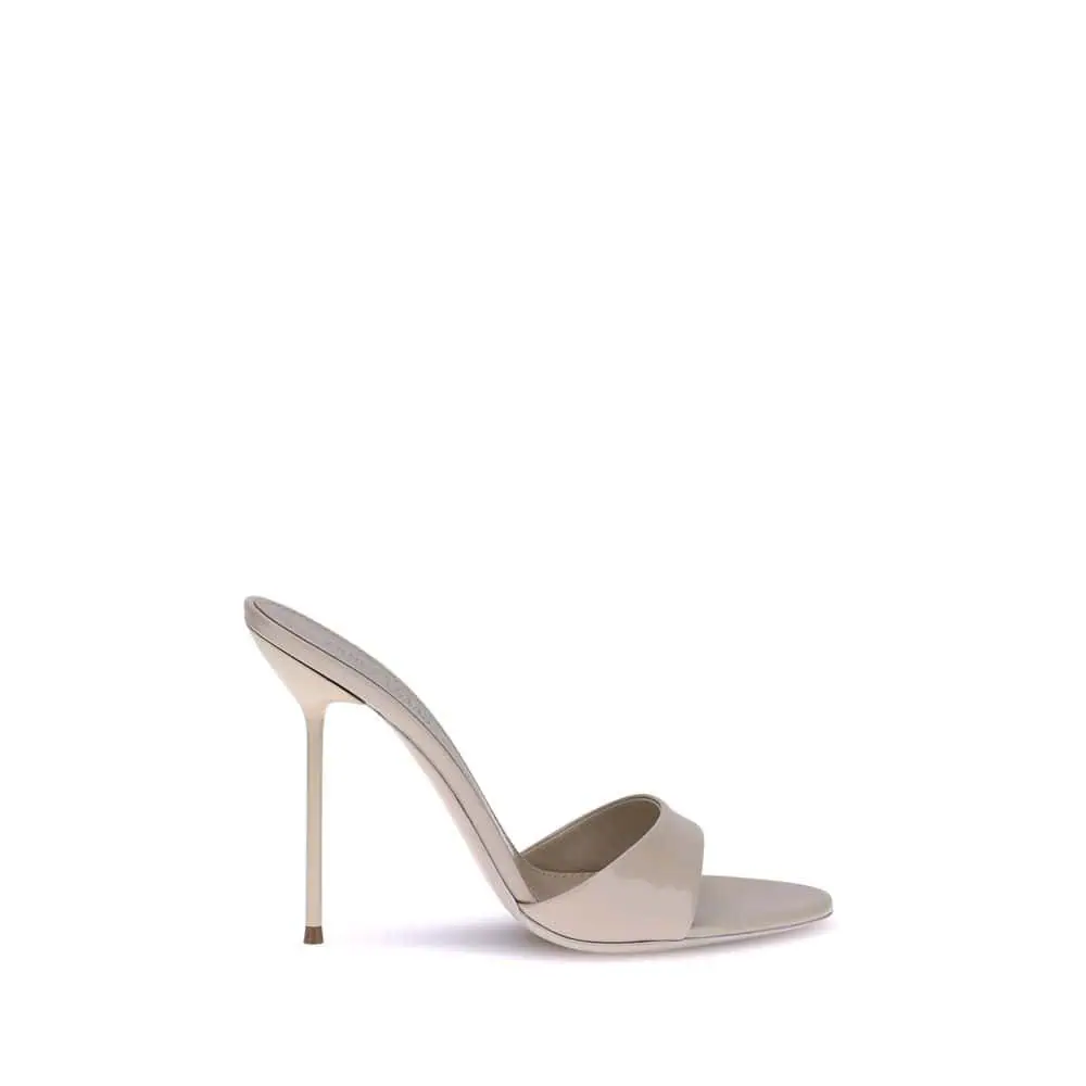 Elegant nude high-heeled mule sandal with sleek design, pointed toe, and stiletto heel for sophisticated style and comfort.