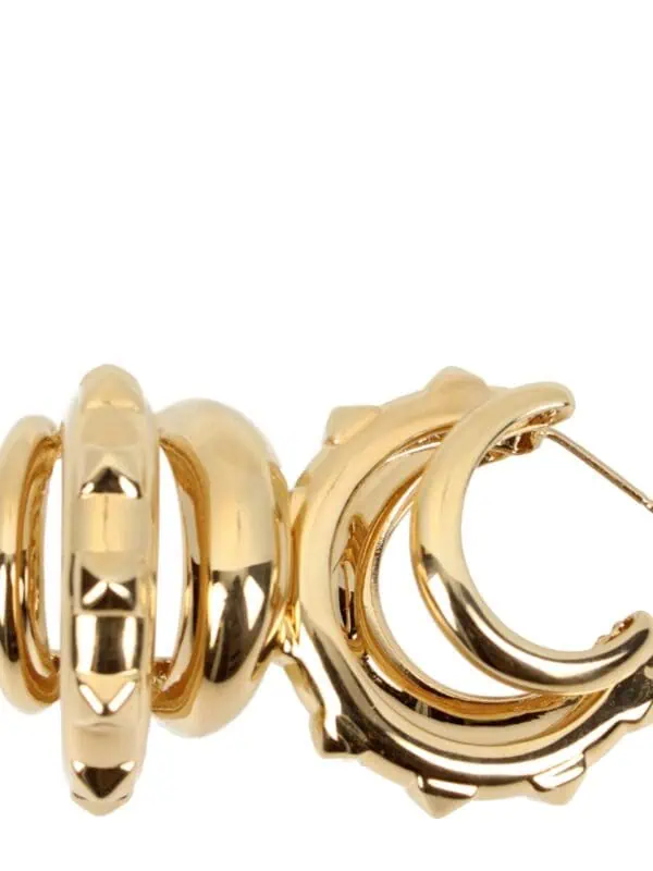 Shiny gold hoop earrings with intricate crescent moon and scalloped edge designs, perfect for stylish and elegant accessories.