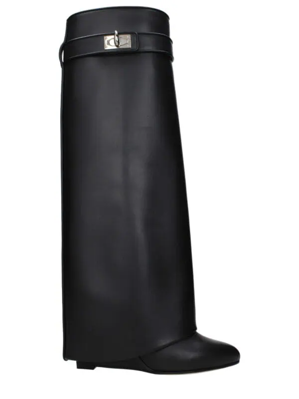 Elegant black leather knee-high boots with silver buckle detail, sleek design perfect for luxury fashion.