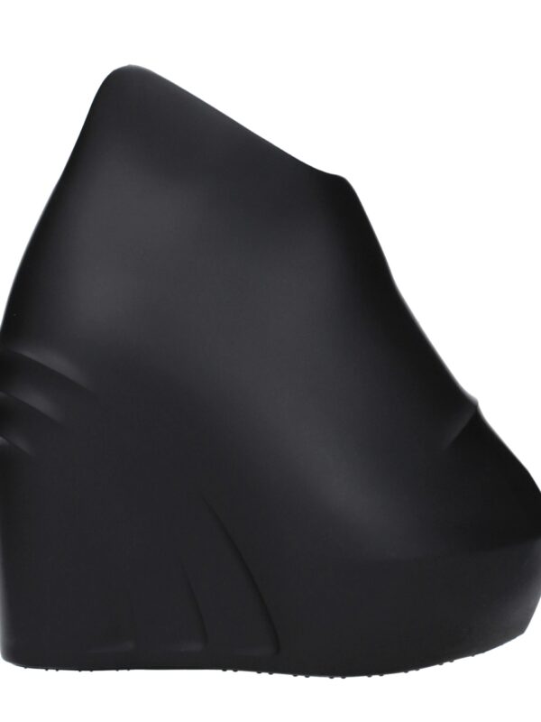 Comfortable black wedge heel sandal with a sleek modern design, ideal for stylish casual or formal outfits. Perfect for elevating everyday fashion with comfort and elegance.
