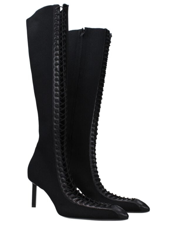 1. Lux black thigh-high lace-up boots with pointed toes and stiletto heels, made from premium materials for a stylish and luxurious look.
