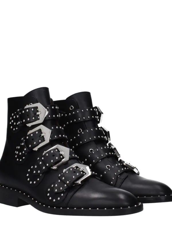 1. Black leather ankle boots with silver studded buckles and straps, stylish and edgy footwear for men and women.