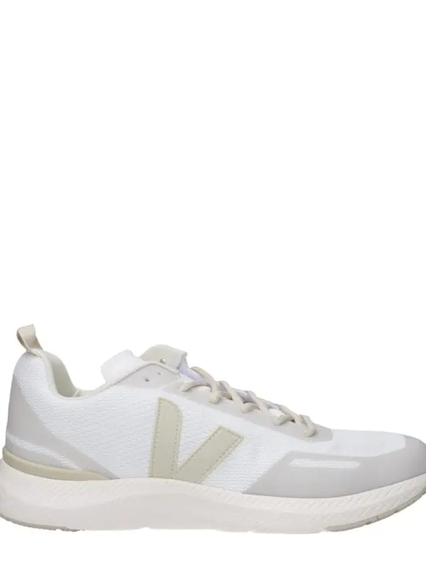 Minimalist white sneaker with beige accents, lightweight mesh upper, cushioned sole, and sleek design for versatile everyday wear. Perfect for sporty and casual outfits.