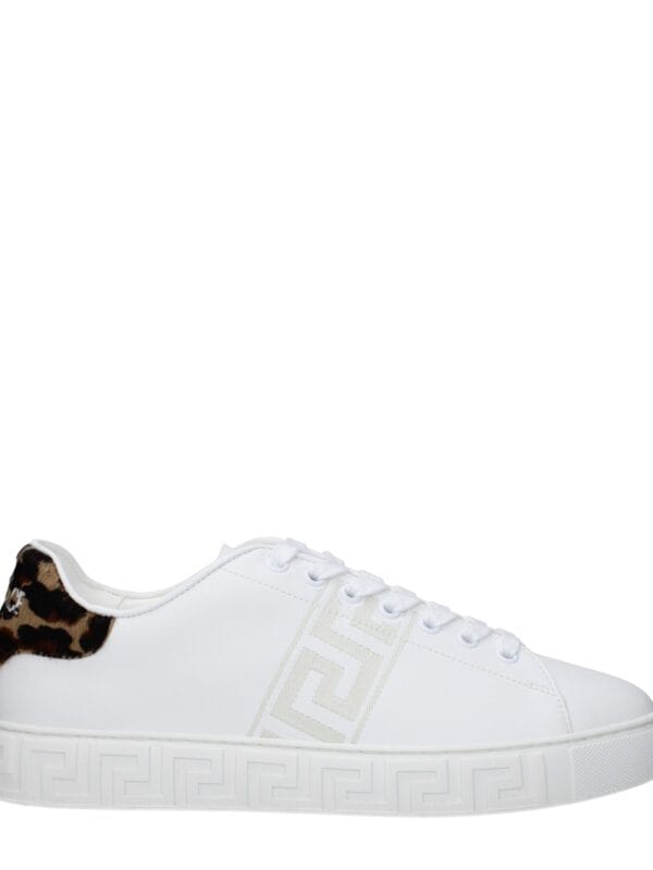 Luxury white sneakers with leopard print accents, embossed sole pattern, and designer logo detail, perfect for chic casual wear.