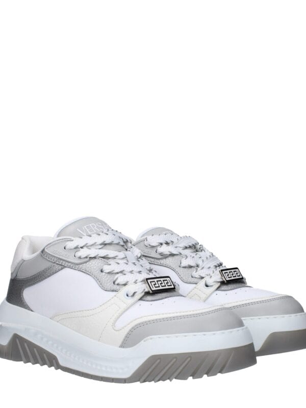 Stylish white and grey Versace sneakers with chunky sole, intricate detailing, and logo accents for a luxurious, on-trend look. Perfect for fashion-forward casual wear.