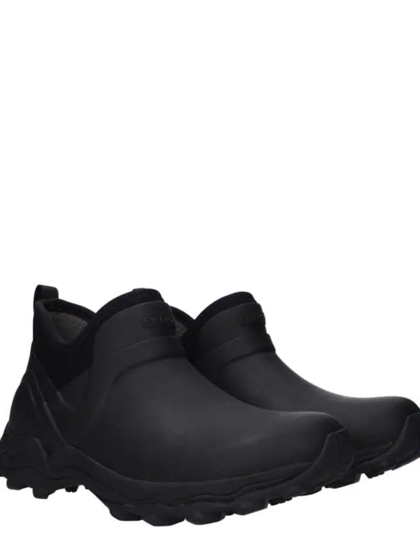 Black slip-on sneakers with chunky soles, modern design, and sleek silhouette for casual and athletic wear. Perfect for urban style and comfort.
