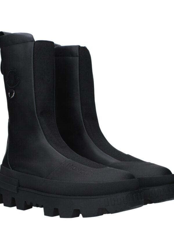 Premium black waterproof Moto boots with rugged sole, ideal for motorcycle riding and outdoor adventure, featuring durable material and comfortable fit for safety and style.