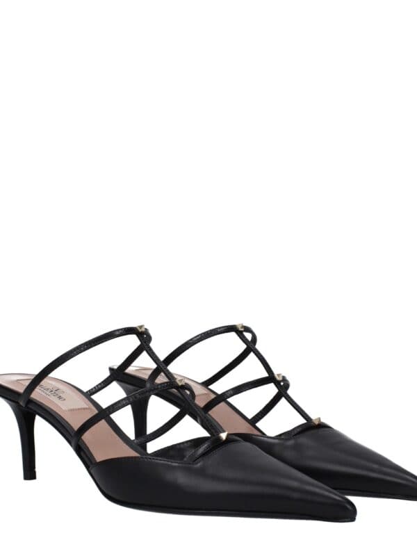 Elegant black pointed-toe high heel shoes with multiple strap accents and gold-tone pyramid studs, perfect for chic, sophisticated outfits.