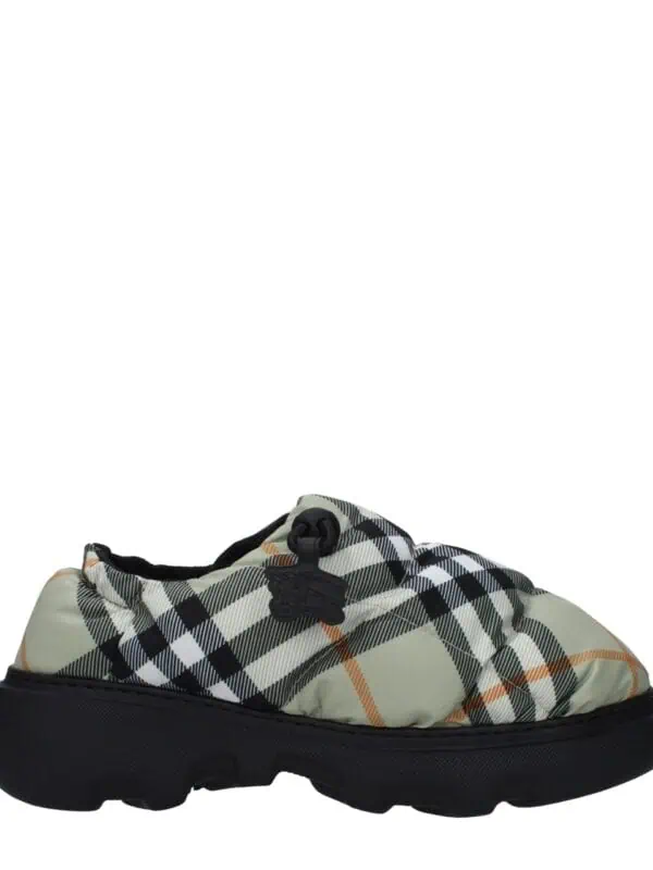 Stylish designer plaid slip-on sneaker with a chunky black sole, perfect for casual or streetwear fashion.