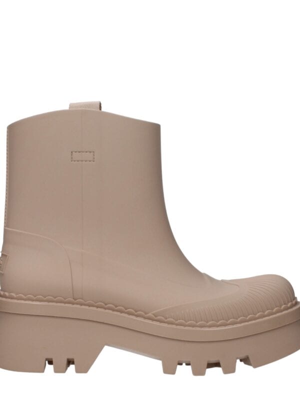 Minimal beige chunky platform boots with rugged sole and sleek design, perfect for fashion-forward and edgy street style looks.