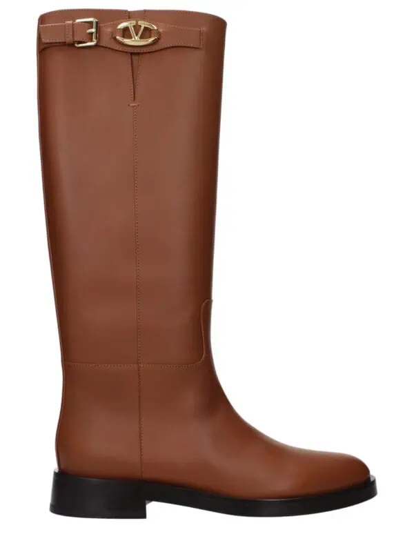 Sophisticated brown leather knee-high boot with gold logo buckle detail, designed for luxury fashion enthusiasts seeking elegant and high-quality footwear.