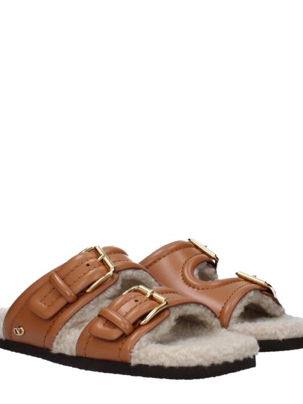 Lux Brands cozy shearling slide sandals with adjustable leather straps and gold buckles, perfect for stylish comfort and casual outings.