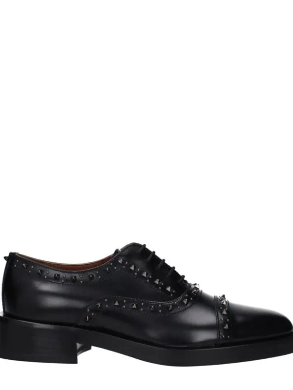 Bold black leather oxford shoe with silver stud embellishments, stylish laces, and a sturdy heel, perfect for sophisticated fashion statements and formal occasions.