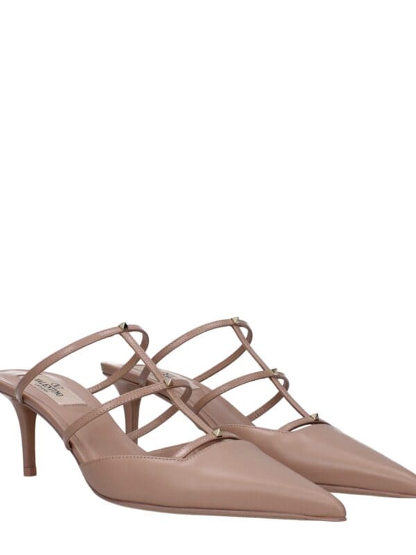 Glossy nude pointed-toe high-heel shoes with multiple thin straps and gold-tone studs, perfect for elegant and fashionable occasions.