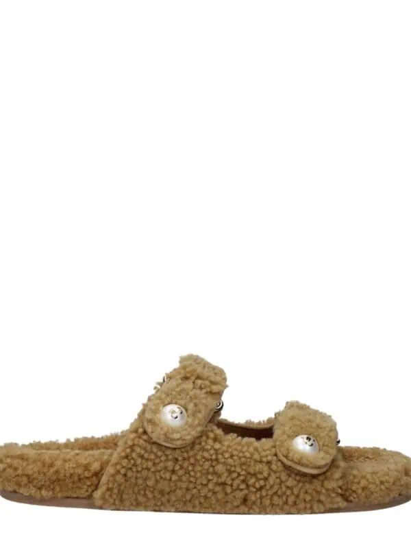 Soft beige plush slip-on slippers with pearl embellishments and fuzzy texture, perfect for cozy indoor wear and luxury comfort.