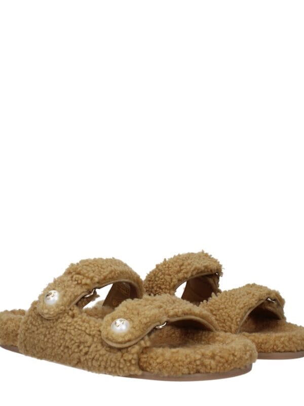 Soft beige shearling slides with pearl embellishments and gold accents, offering stylish comfort and luxurious design for trendy casual wear.