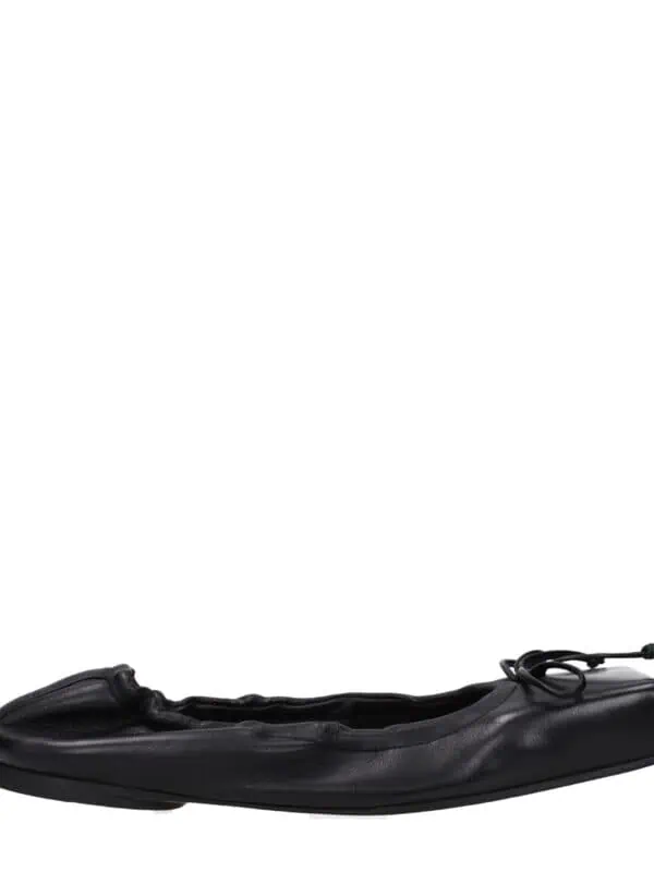 Flexible black leather ballet flat shoe with bow detail, lightweight and comfortable for everyday wear, versatile stylish footwear for women.