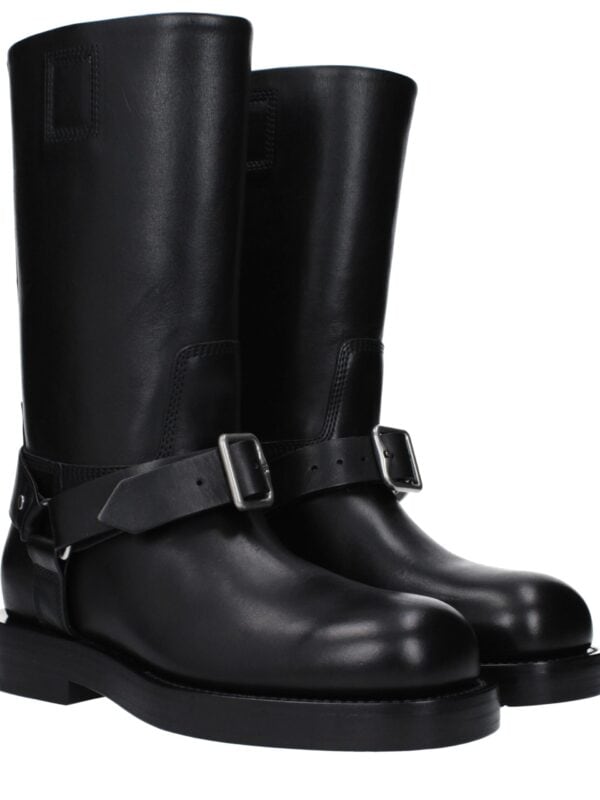 Lux black leather knee-high boots with buckle strap detail, stylish and versatile footwear for high fashion and everyday wear. Perfect for adding a luxurious touch to your wardrobe.