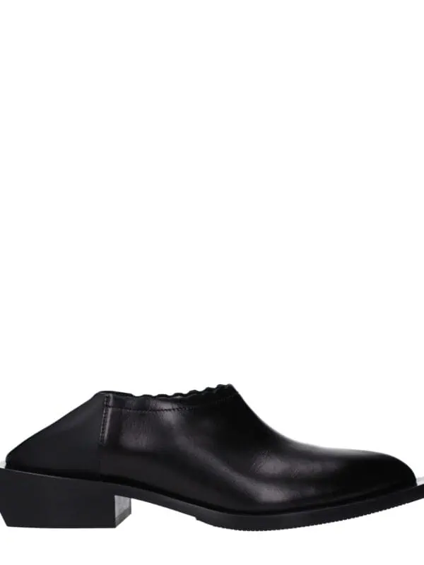1. Elegant black leather low-heeled mule shoe with sleek design and comfort fit, perfect for stylish everyday wear or casual outings.