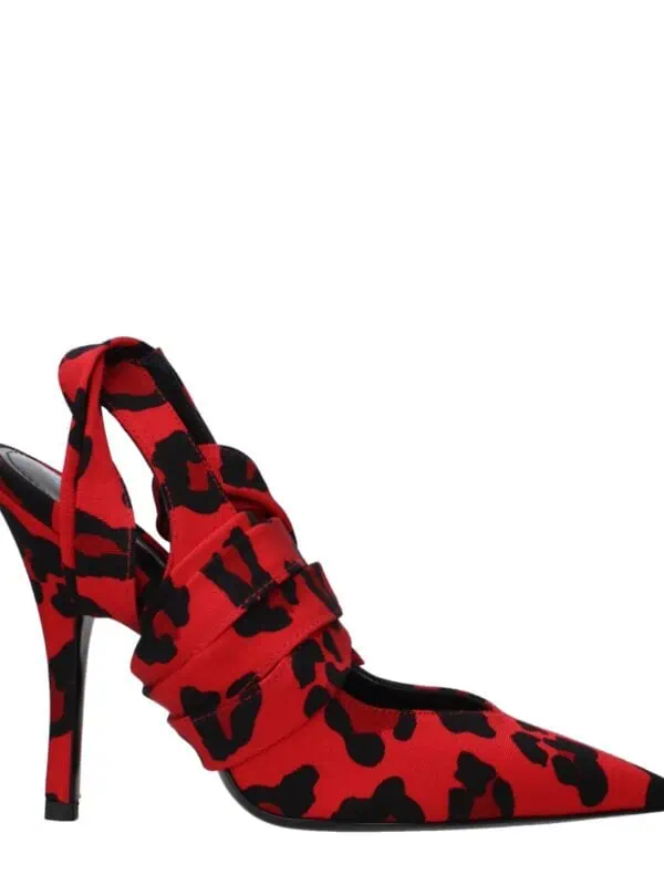 Vibrant red and black leopard print high heel stiletto shoe with pointed toe and ankle strap, styled for bold fashion statements and luxury footwear collections.