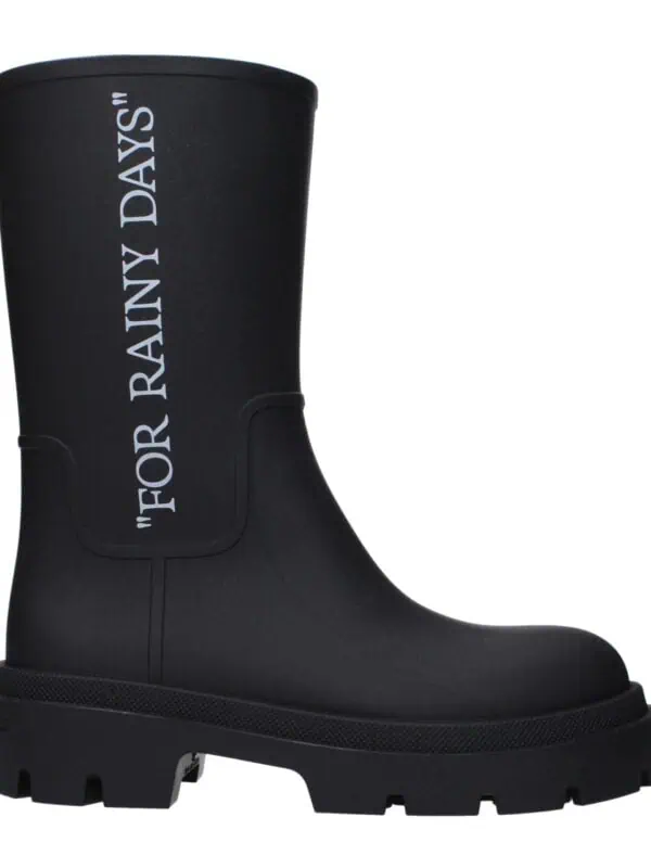 Black designer rain boot with bold white text "FOR RAINY DAYS" on the side, featuring a chunky sole for durability and style, perfect for wet weather.