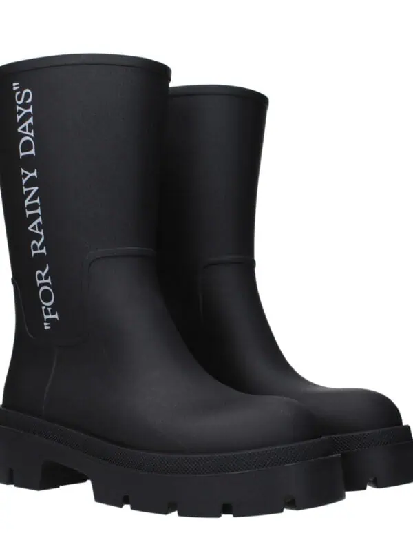 Black waterproof rain boots with bold white text "FOR RAINY DAYS" on the side, featuring chunky soles and a sleek matte finish, perfect for stylish rainy weather wear.