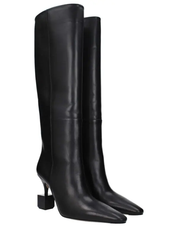 Elegant black leather knee-high boots with pointed toes and unique block heels, perfect for luxury fashion statements and stylish occasions.