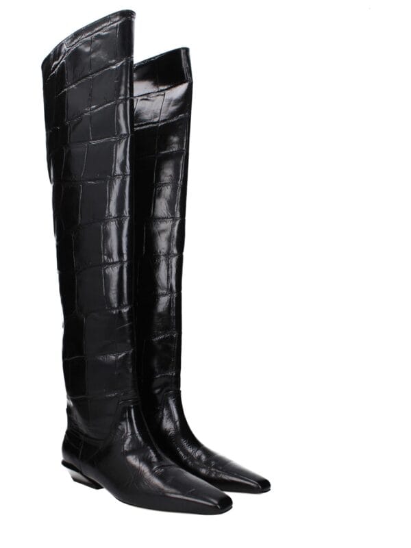 Black crocodile leather knee-high boots with pointed toes and low heels for luxury fashion.