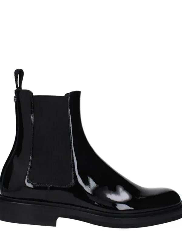 Glossy black patent leather ankle boot with elastic side panels and pull tab, stylish and modern footwear for versatile casual or dressy occasions.