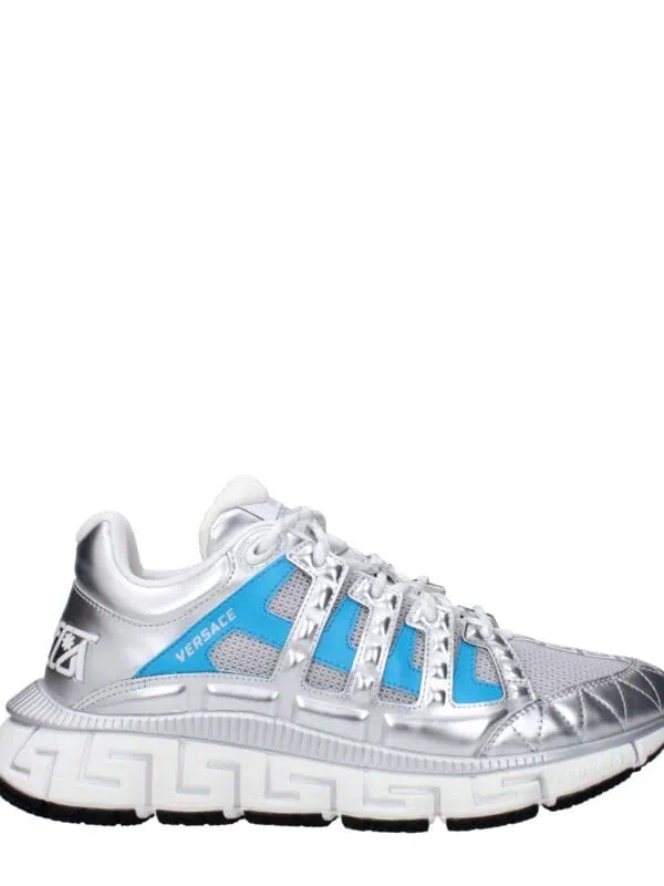 Versace Chain Reaction sneakers in silver with blue accents, sporty design, and chunky sole for luxury athletic style.