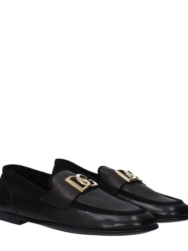 Luxury black leather loafers with gold-tone hardware and classic slip-on design, perfect for sophisticated style and all-day comfort.
