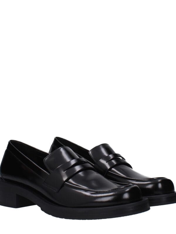 Luxury black leather loafers with a sleek design and sturdy heel, perfect for stylish formal and casual wear. Crafted with high-quality materials for comfort and durability.