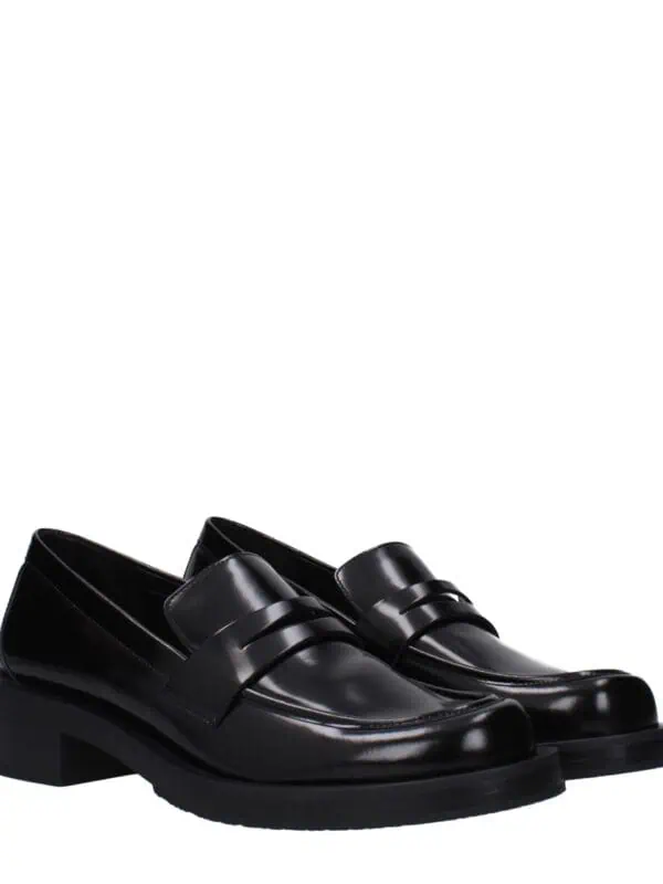 Luxury black leather loafers with a sleek design and sturdy heel, perfect for stylish formal and casual wear. Crafted with high-quality materials for comfort and durability.