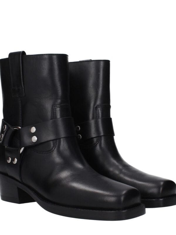 Black leather ankle boots with decorative strap and silver accents, stylish and luxurious footwear for women.