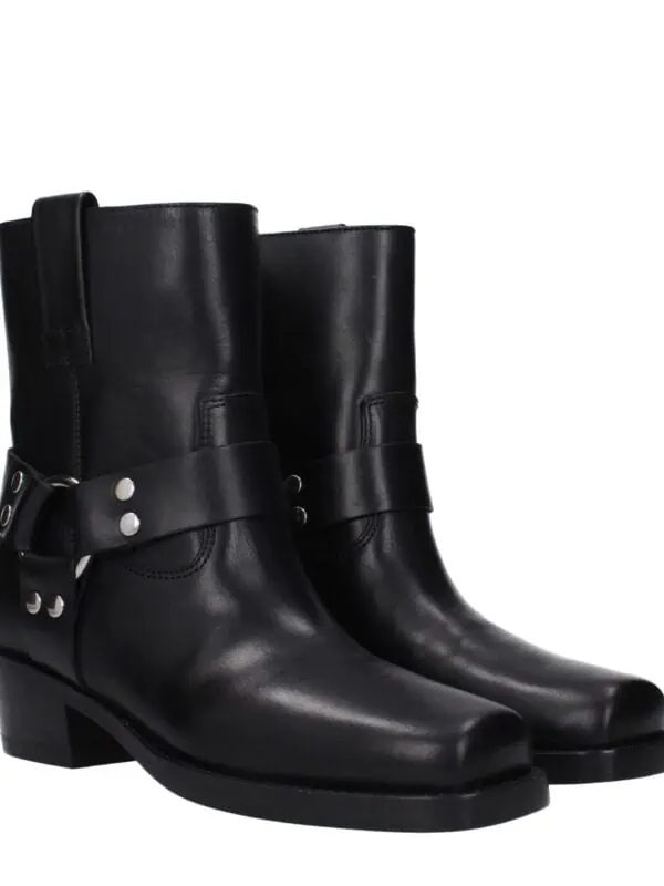 Black leather ankle boots with decorative strap and silver accents, stylish and luxurious footwear for women.